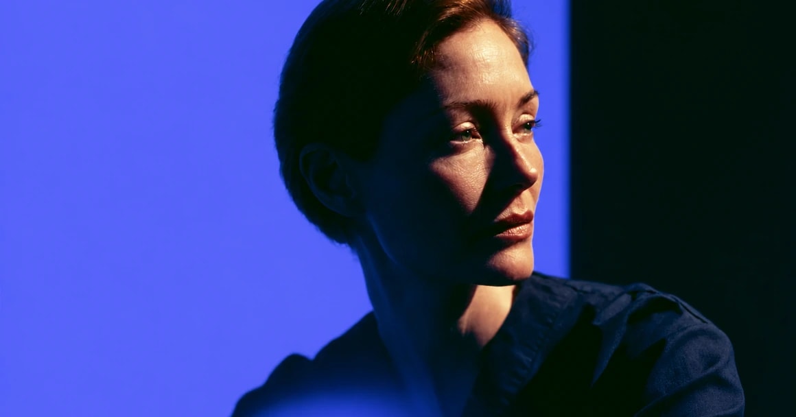 Portrait lit in brand blue